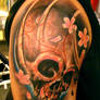 skull tattoo and flowers