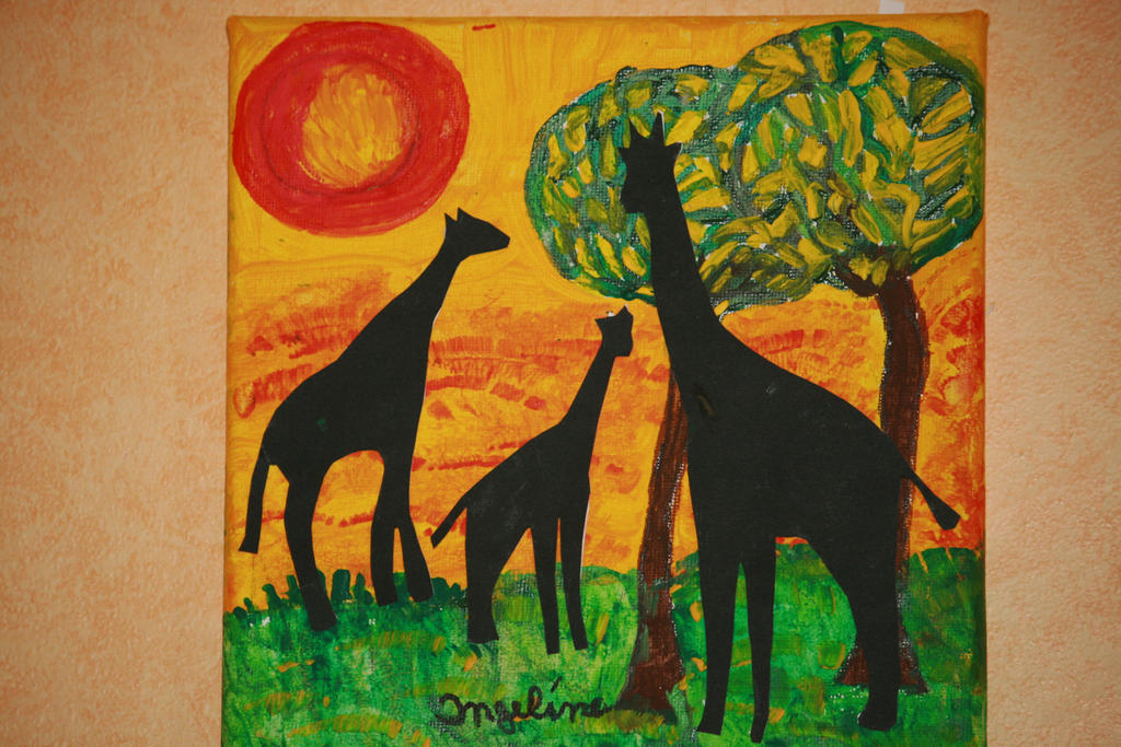 Happy giraffes in sunset