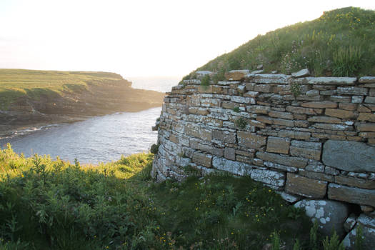 Ruined broch (tower), on cliff, Orkney, Scotland