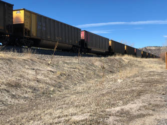 Colorful train against blue sky