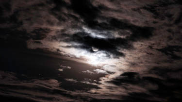 Moon on cloudy sky