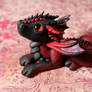 Black and red polymer clay dragonet