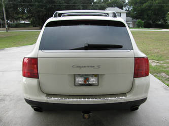 white Porsche Cayenne rear