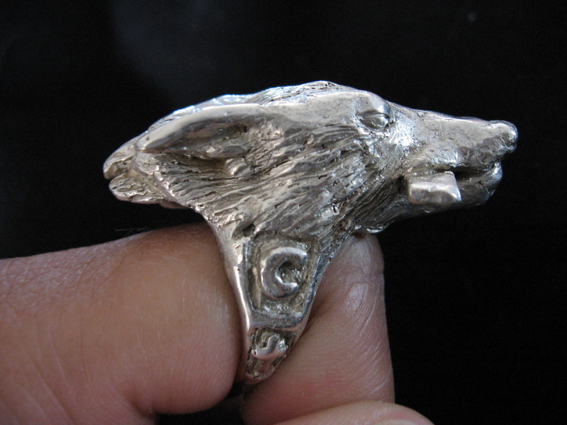 Wolf ring on finger