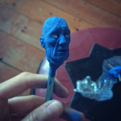 Plasticine miniature head toothpick sculpting