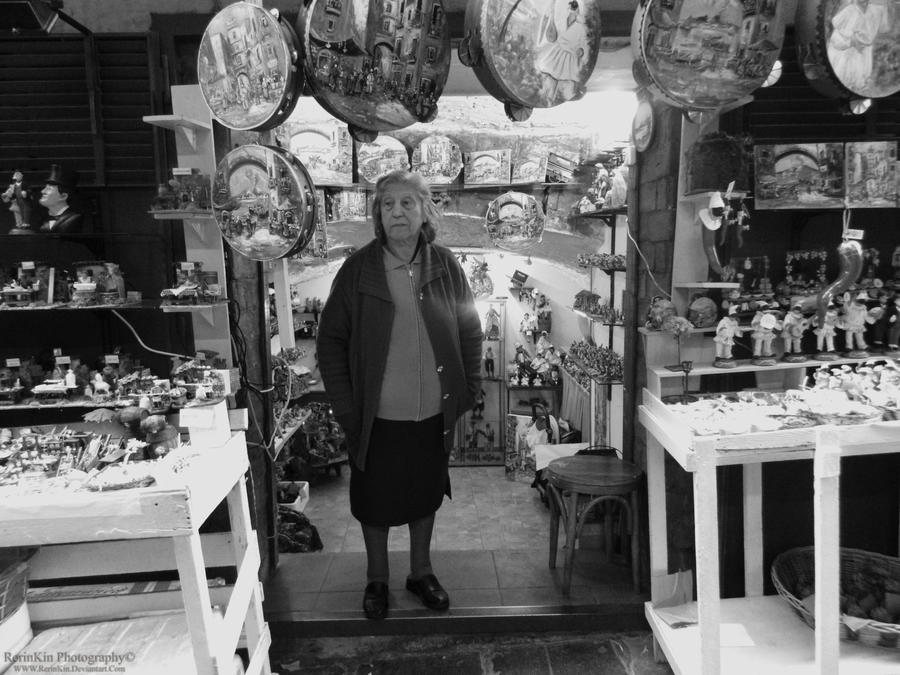 Old lady in shop at San Gregorio Armeno Naples