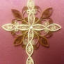 Gold and cream cross quilling