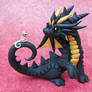 Black dragon with tiny mouse friend