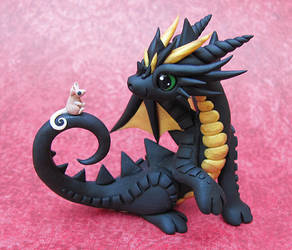 Black dragon with tiny mouse friend