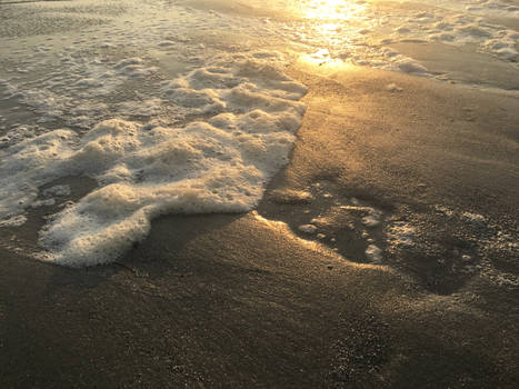 Sea Foam on a Sandbar