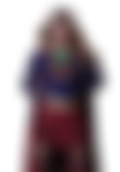 Supergirl hands behind back wearing Krypto-collar