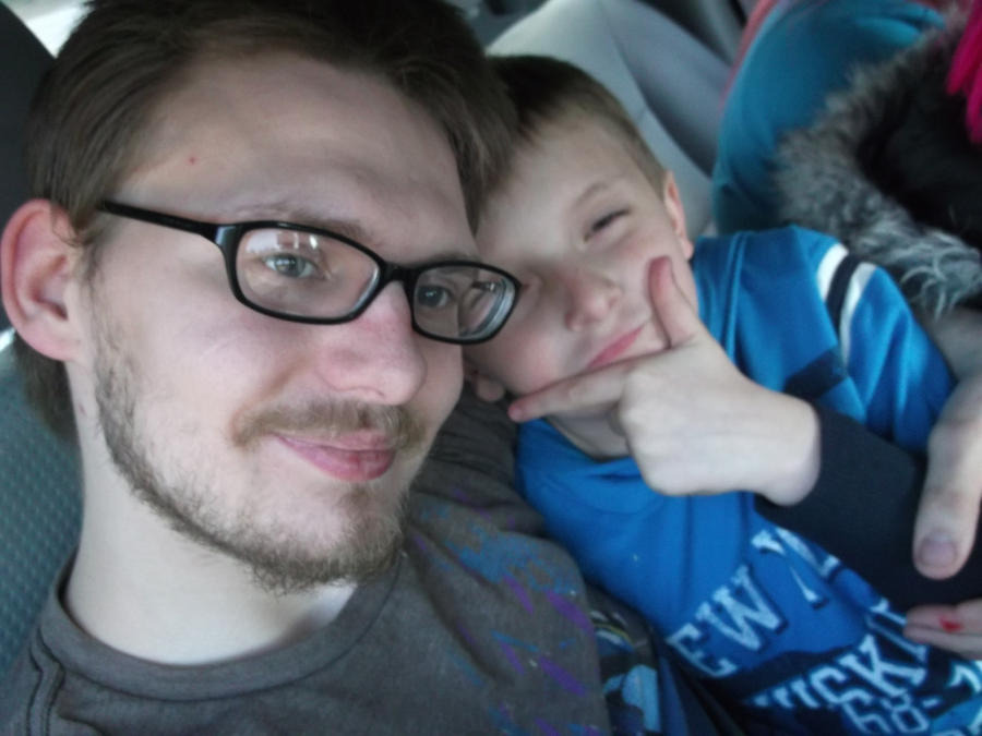 My little brother Tristan and me in the car