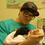 Zak feeding a puppy