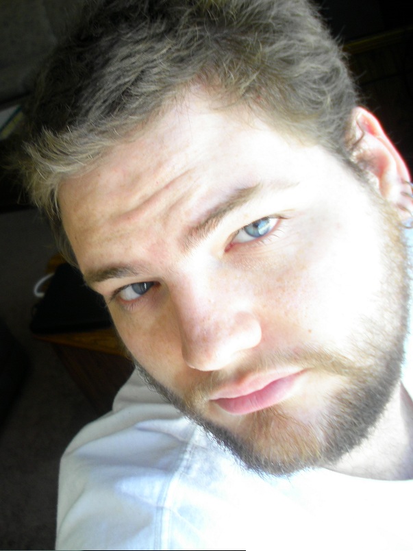Headshot of blue-eyed guy