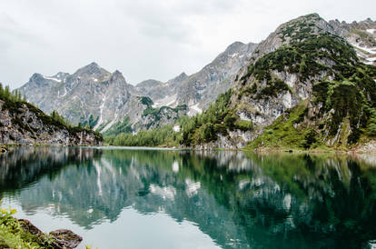 Mountains mirroring in Austrian lake