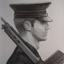 Soldier with shouldered rifle.