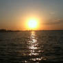 sun goes down on sea