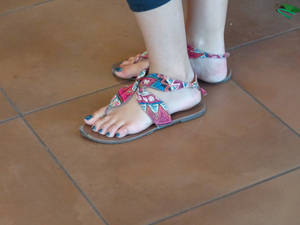 Random brunette's feet at a bread shop