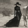 Full-length stunning model in long black dress wit