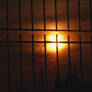 Sunset behind bars