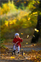 Autumn, park and her bicycle