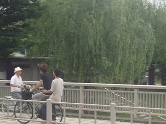 asians on a bike. kawaii.