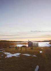 Sunset by a frozen lake