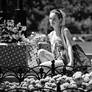 Girl near a flowerbed BW