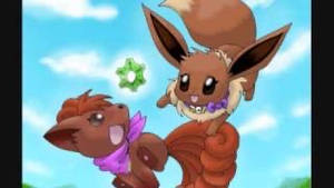 Eevee and Vulpix playing with a green crystal