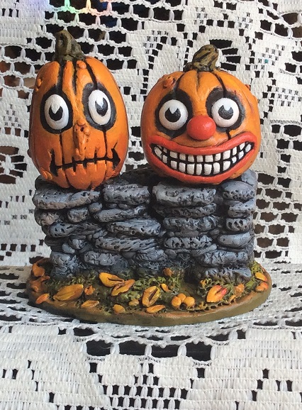 Jack-O-Lanterns on a Stone Wall.