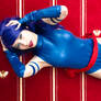 Psylocke laying in red