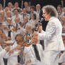 Goran Bregovic on the stage in white suit with his