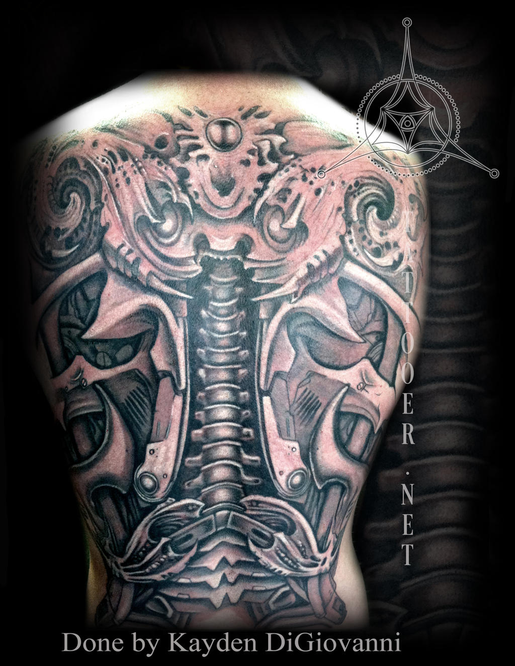 mechanical biomechanical backpiece tattoo