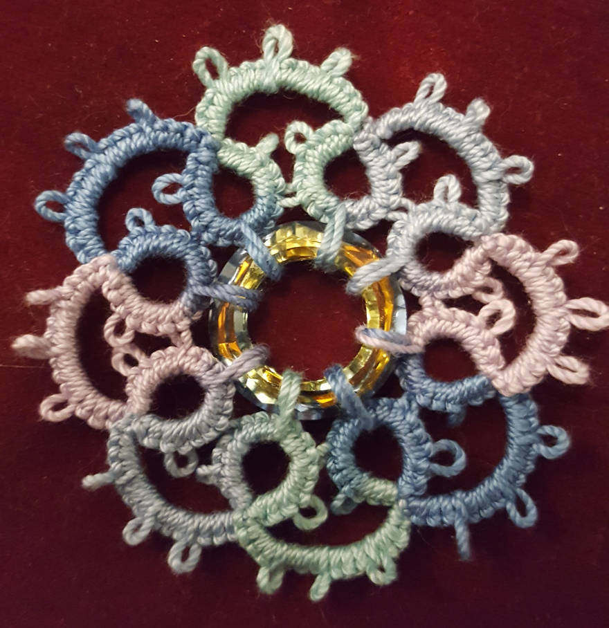 My take on 'button' tatting by KaelStelaris on DeviantArt