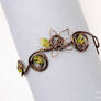 Wire armband with green leaves
