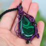 Malachite pendant with purple wrapping
