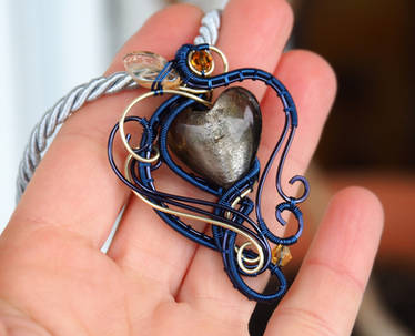 Navy blue and gold wire wrapped heart pendant