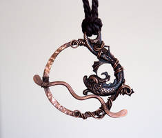 Antiqued copper dolphin pendant
