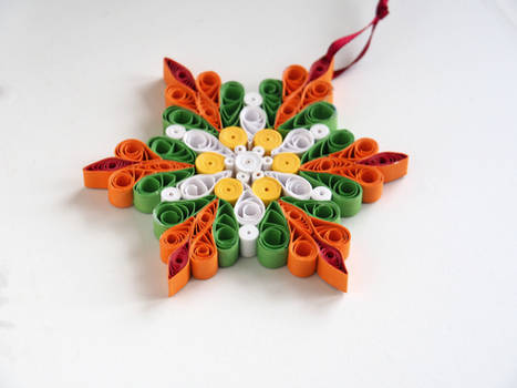 Quilling paper snowflake - orange and green