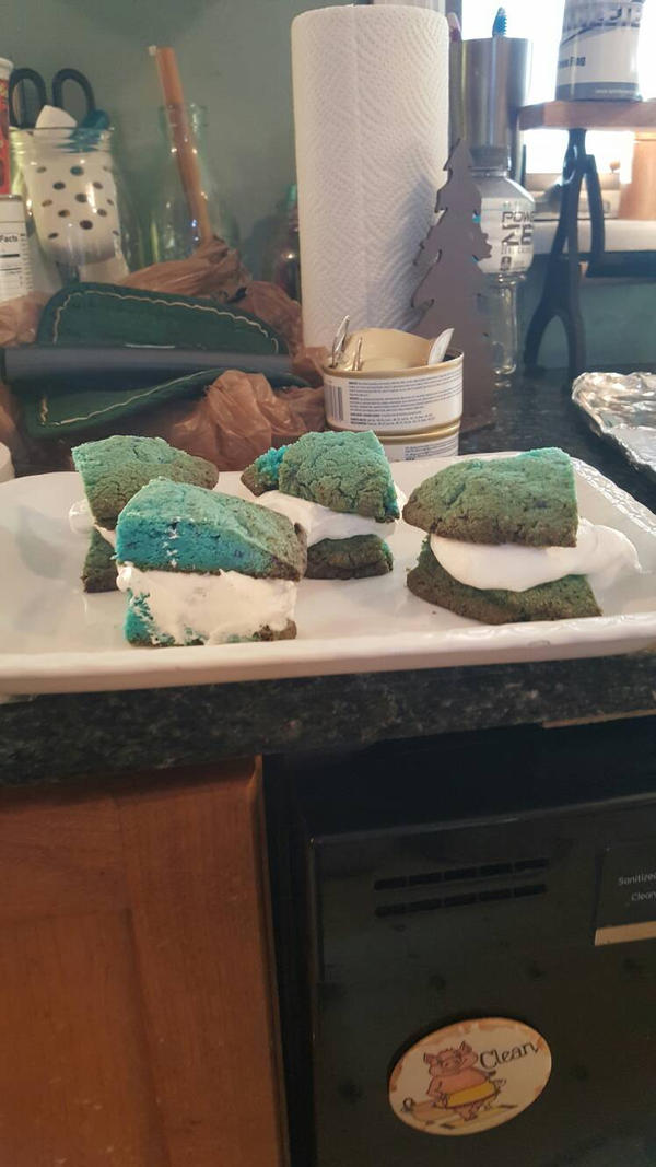 Blue raspberry cookies with a whipped cream center by DemonKitty32 on ...