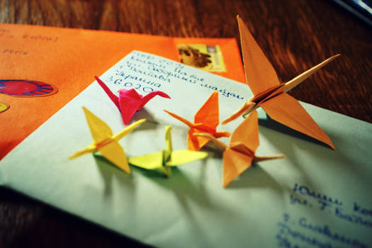 paper cranes on letters