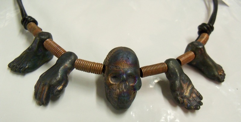 Raku skull, hands and feet choker