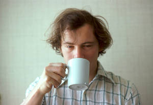 crazy man holding coffee