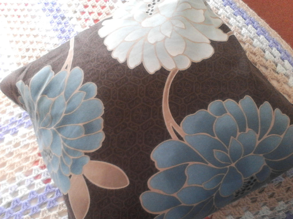 brown and blue flowers cushion