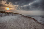 Sunset over the Baltic Sea in winter by CitizenFresh