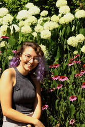 Posed by the flowers