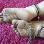 Shackled feet