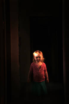 In a darkened hallway