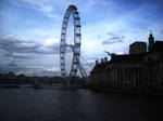 The London Eye from a bridge by loobyloukitty