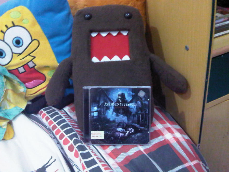 domo-kun plushie and a7x album